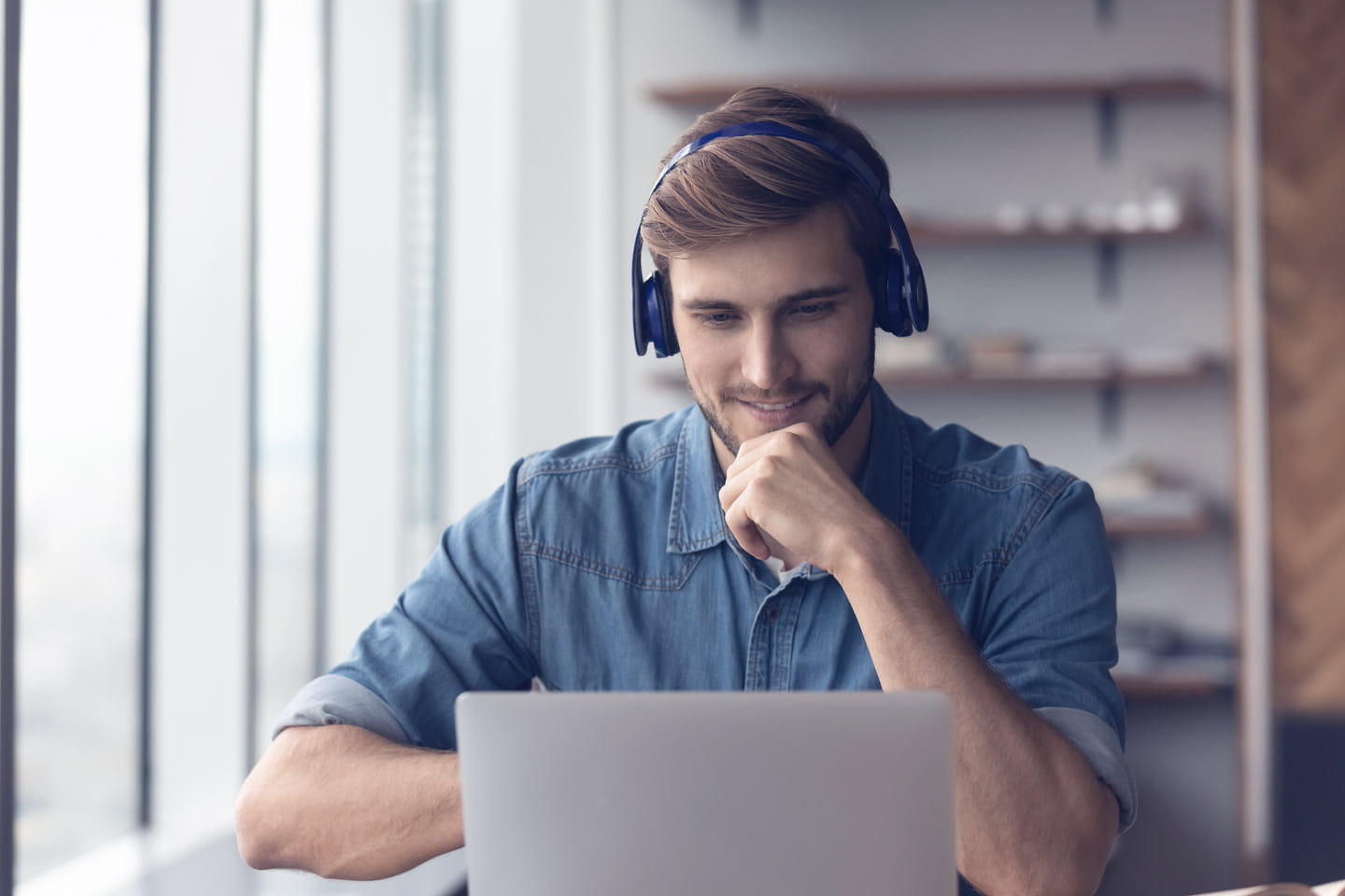 Man watching content on laptop