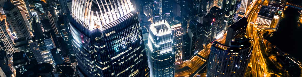 Canary Wharf London cityscape at night with HSBC building